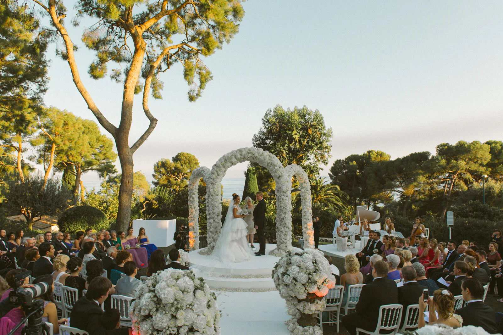 Bride and groom at an outdoor Grand-Hôtel du Cap-Ferrat wedding ceremony on the French Riviera
